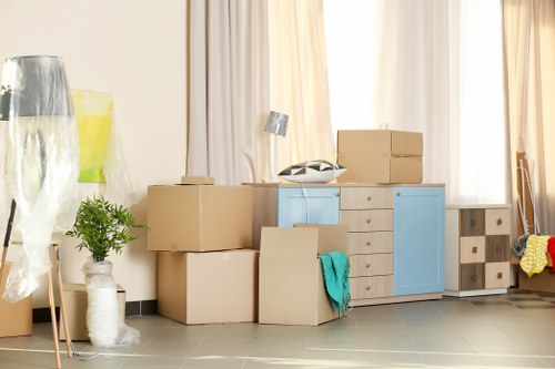Furniture pick-up team handling a sofa collection in Uxbridge