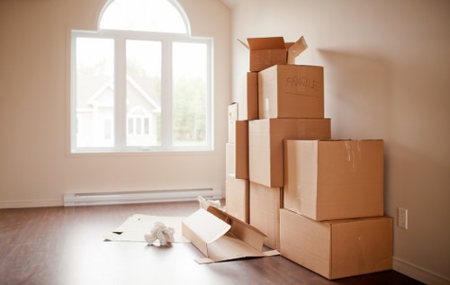 Removal van and moving boxes outside a Uxbridge home