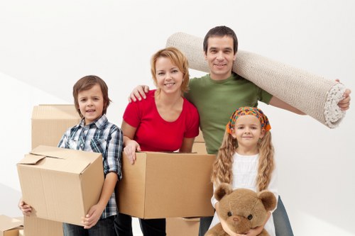 Removal team handling household furniture and boxes for a Uxbridge house move