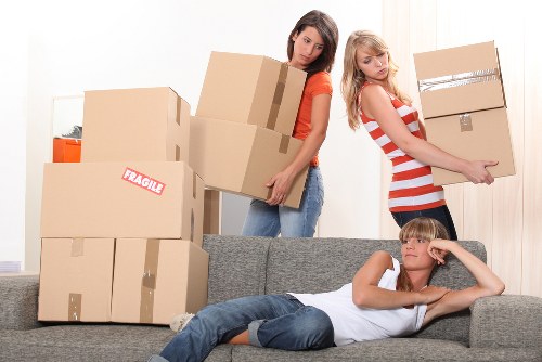 Furniture and boxes being loaded into a moving van