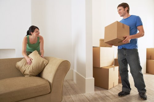 Business relocation boxes and office furniture prepared for unloading in Uxbridge