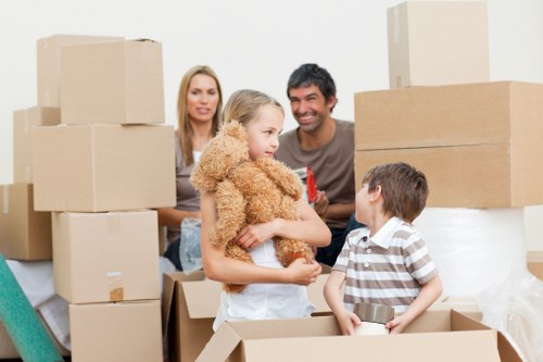 Boxes and furniture arranged for unloading at a new Uxbridge home